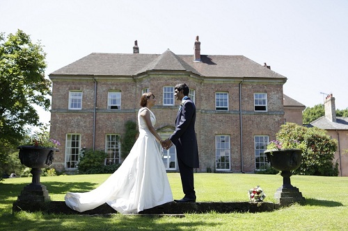 A couple in front of the hall